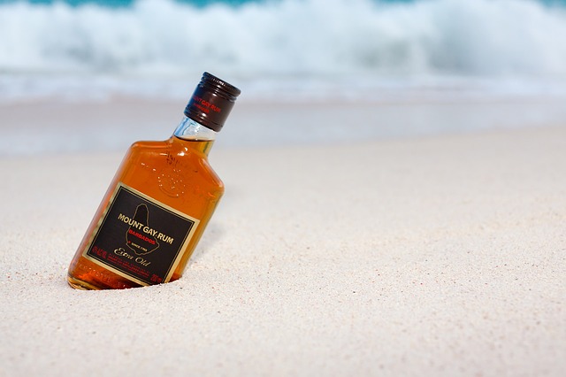 Mount Gay rum in sand