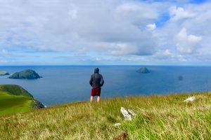 Derek Cullen overlooking the habor on the Great Blasket Island in Irleland