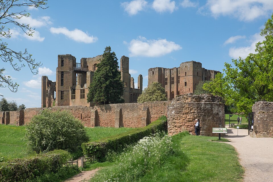 Ruins of Kenilworth Castle surrounded by lawns and trees in Warwickshire, England