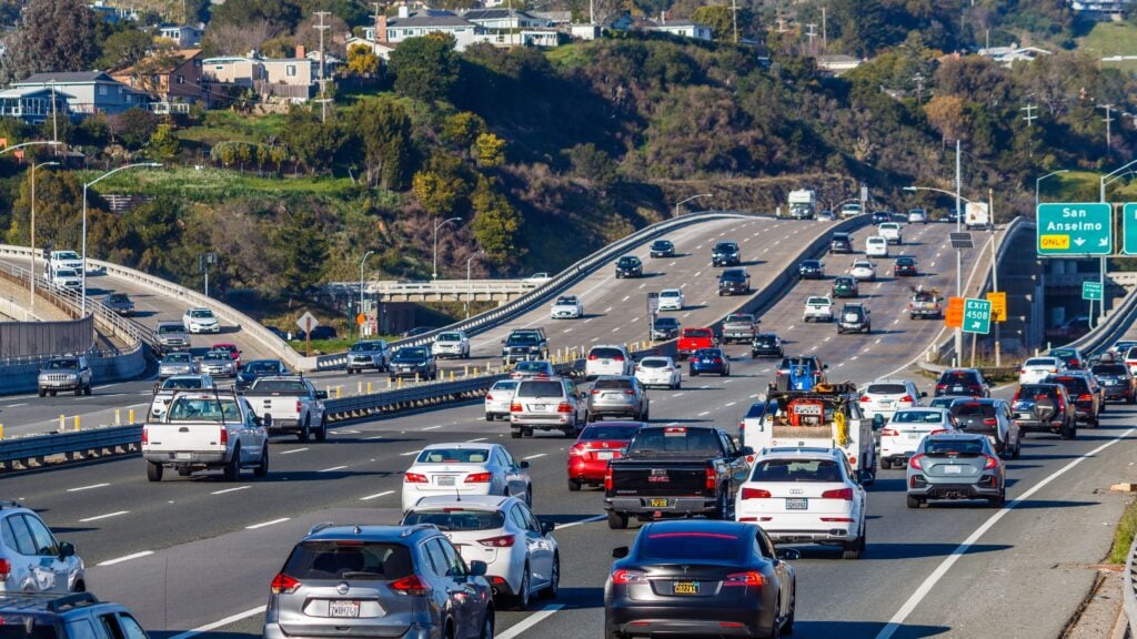 crowded highway with heavy traffic Cars and trucks traveling along a busy multilane California highway.