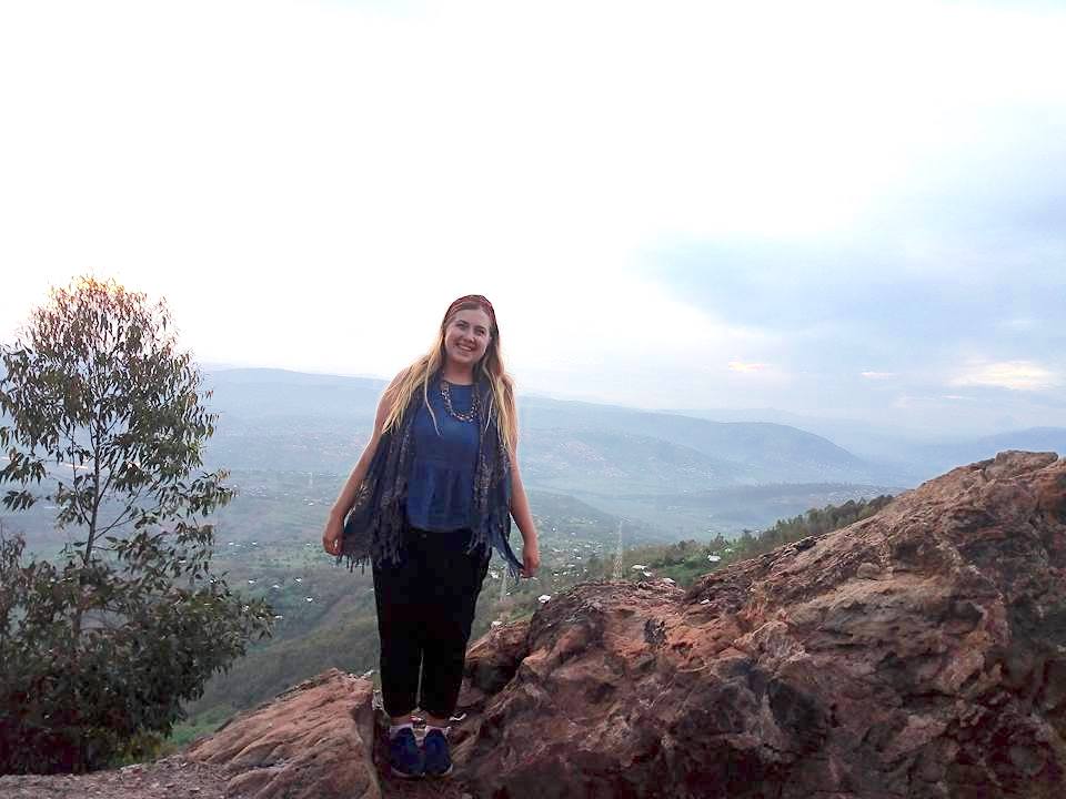 Lydia Klemensowicz overlooking Rwanda’s green hills during a solo trip