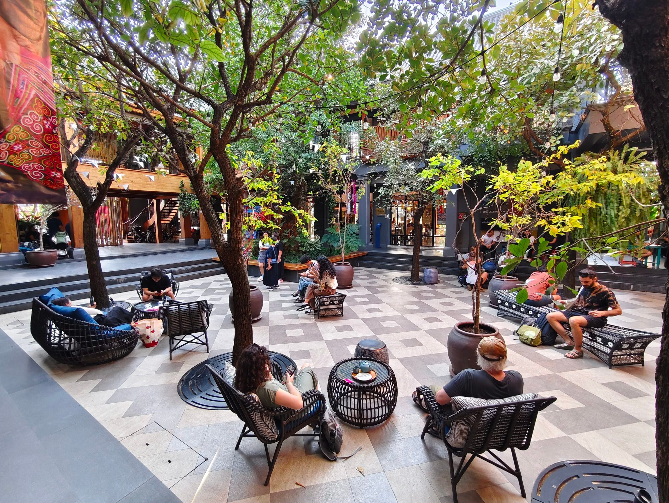 Visitors chill out in the courtyard at Kalm Village. Photo Teh Chin Liang