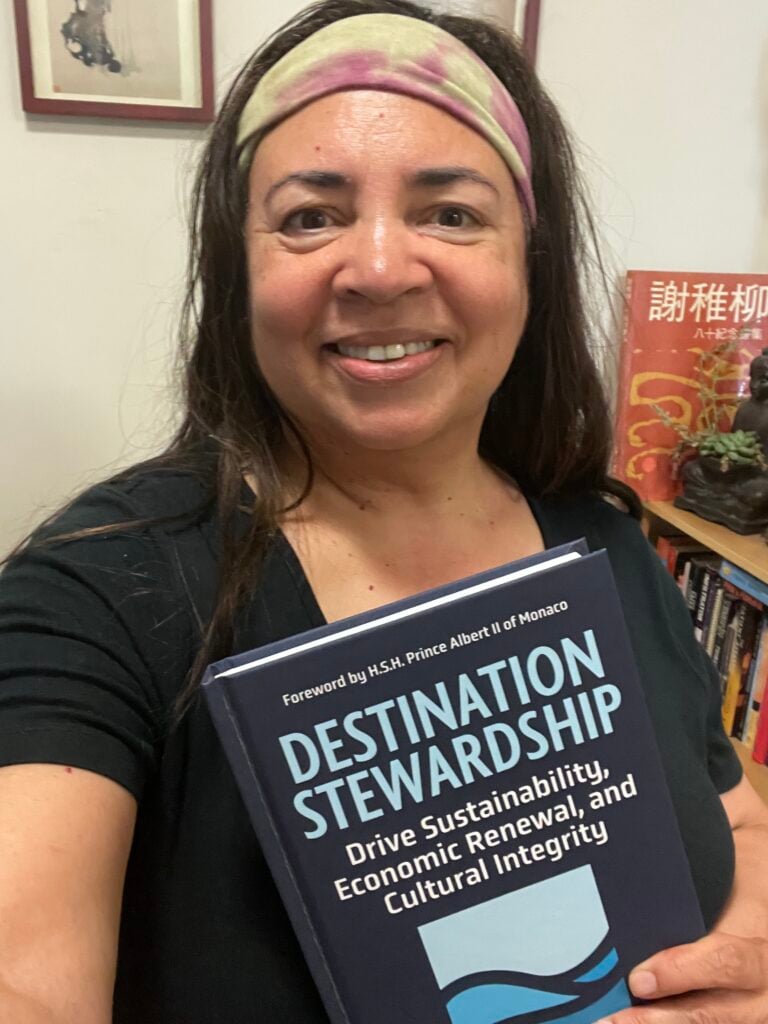 Tonya with her advanced copy of her book Destination Stewardship