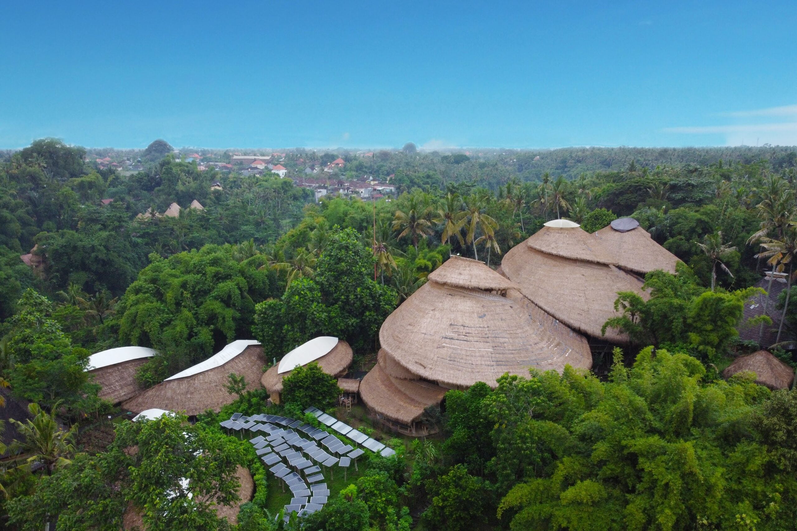 Green School From above, the campus looks like conical hats surrounded by nature Photo Green Scholl Bali