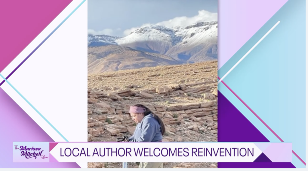 Tonya trekking in Morocco MM Show teaser Tonya Fitzpatrick shown trekking with mountains in background. MM Show Morocco teaser image