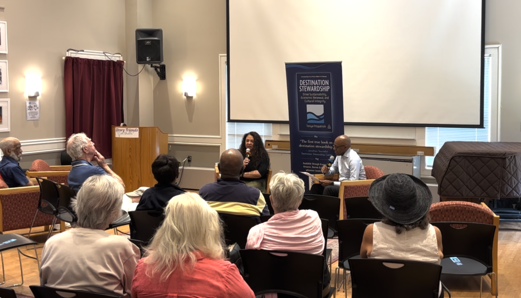 Tonya Fitzpatrick speaking with Ian Fitzpatrick during a Destination Stewardship author talk at Oak Bluffs Public Library.