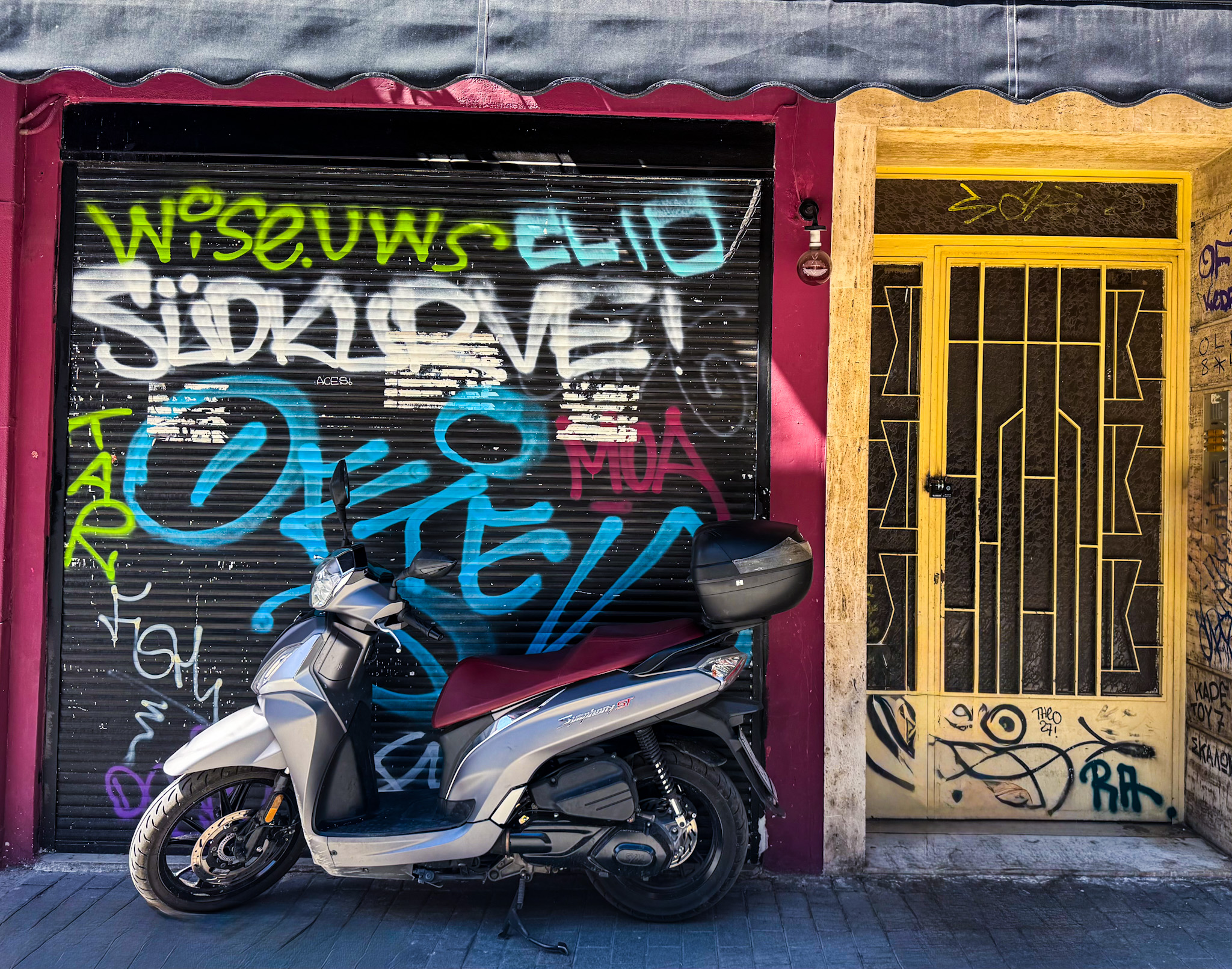 Psirri Freedom of expression in the form of raw, expressive murals and graffiti tags that reflect the city's youth, culture, and socio political climate. jpg Mural painted by local youth in Athens neighborhood of Psirri